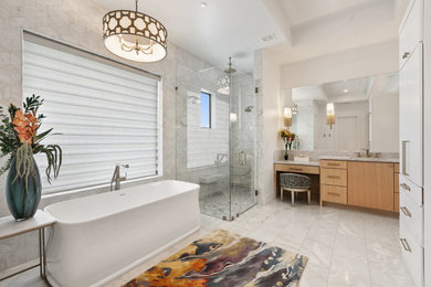 Large master white tile and marble tile marble floor, white floor and double-sink bathroom photo in Austin with flat-panel cabinets, light wood cabinets, white walls, an undermount sink, marble countertops, a hinged shower door, gray countertops and a built-in vanity