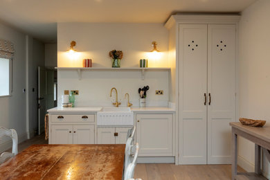 This is an example of a farmhouse kitchen in Surrey.