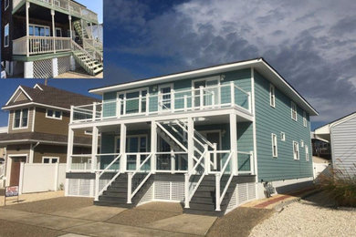 Inspiration for a green two-story vinyl exterior home remodel in New York with a shingle roof
