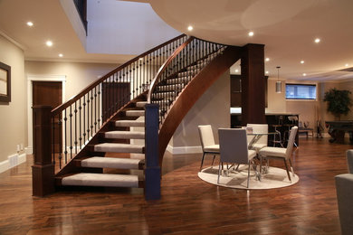 Staircase - mid-sized traditional wooden curved staircase idea in Other