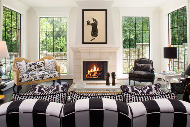 Example of a mid-sized eclectic enclosed painted wood floor living room design in Columbus with white walls, a standard fireplace, a stone fireplace and no tv