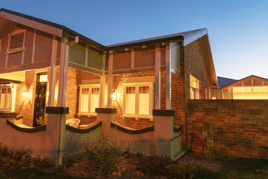 Photo of a transitional home design in Newcastle - Maitland.