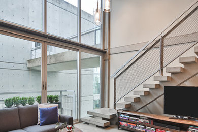 Living room - industrial living room idea in Vancouver