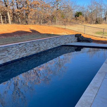 Custom pool with elevated back wall and LED Waterfalls