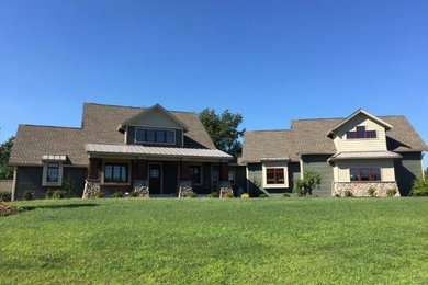 Large craftsman green two-story vinyl exterior home idea in Philadelphia with a mixed material roof