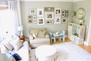 Living room library - mid-sized traditional enclosed light wood floor and brown floor living room library idea in Bridgeport with gray walls, no fireplace and no tv