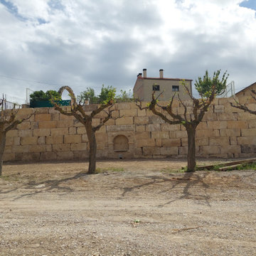 MUR DE CONTENCIÓ AMB PEDRA D'ESCULLERA A ELS OMELLONS