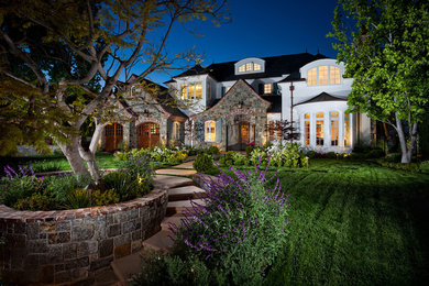 Traditional white exterior in Orange County with stone veneer.
