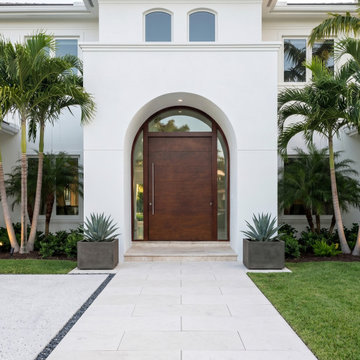 Custom Arched Hurricane Pivot Door Entry | Coral Gables Luxury Home
