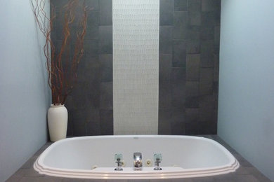 Bathroom - mid-sized contemporary master stone tile ceramic tile bathroom idea in Chicago with a one-piece toilet and gray walls