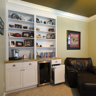 Inspiration for a small traditional enclosed home cinema in Miami with green walls and carpet.