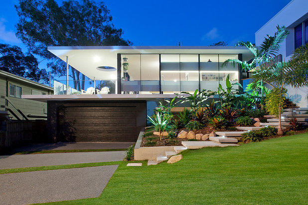 Midcentury Exterior by Aboda Design Group