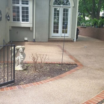 Exposed Aggregate patio with brick border.
