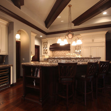 Three Level Island with Off White Painted Cabinets and Dark Stained Cabinets