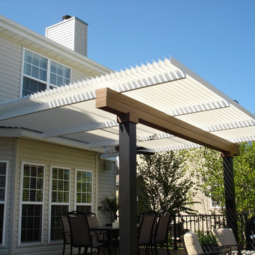 Deck with louvered roof, fire feature, and inset hot tub - Dardenne Prairie, MO