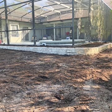Retaining wall to prevent erosion and create planting beds