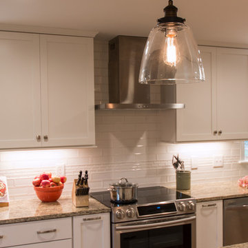 Crown moulding to the ceiling this bright kitchen sparkles.