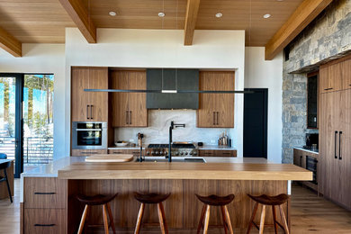 Example of a large minimalist light wood floor kitchen design in Denver with flat-panel cabinets, medium tone wood cabinets, quartzite countertops, stone slab backsplash and an island