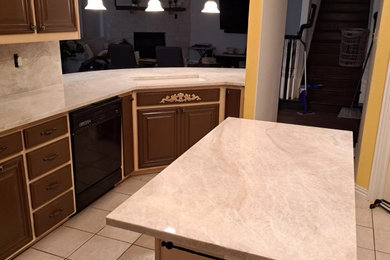 Inspiration for a large rustic u-shaped eat-in kitchen remodel in Dallas with a double-bowl sink, open cabinets, brown cabinets, quartzite countertops, brown backsplash, an island and brown countertops