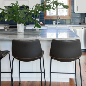 Marble Island with Navy Blue Thin Brick Backsplash