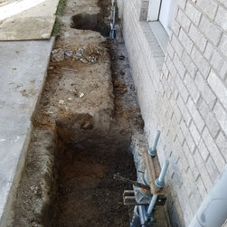 Foundation repair with helical piers spaced as needed to transfer weight to pier - Products