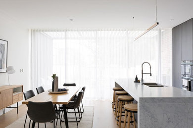 Design ideas for a contemporary kitchen/dining combo in Sydney with white walls.