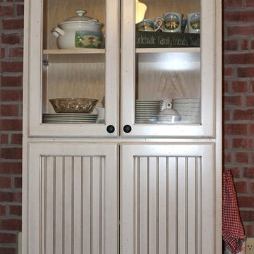 Upper Cabinet With Glass Doors Lowered To The Base Cabinet