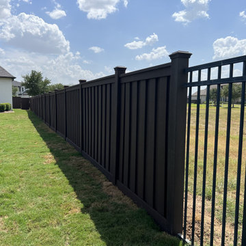 Dark Brown Composite Trex Fence and Black Iron Fence