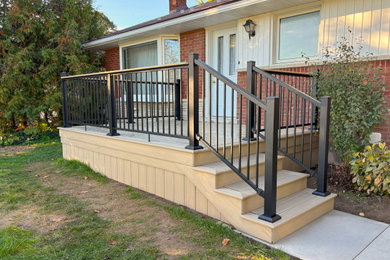 Inspiration for a mid-sized transitional metal railing deck remodel in Toronto with no cover