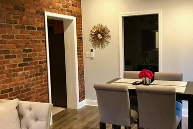 Inspiration for a mid-sized rustic medium tone wood floor great room remodel in Other with gray walls