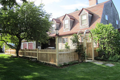 Inspiration for a mid-sized timeless front yard stone patio remodel in Boston with no cover