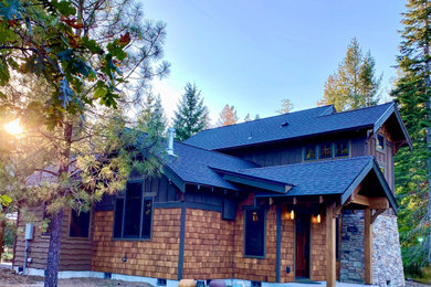 Example of a mountain style exterior home design in Portland
