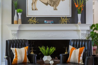 Inspiration for a transitional living room in Los Angeles with white walls and a standard fireplace.