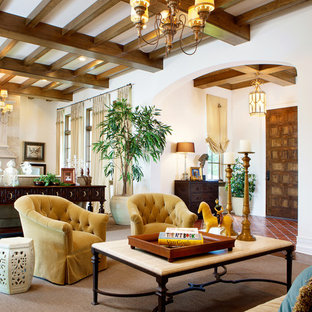 Inspiration for a medium sized mediterranean formal enclosed living room in Miami with beige walls, a standard fireplace, a stone fireplace surround, no tv, brown floors and terracotta flooring.