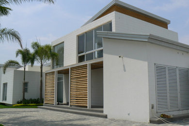 This is an example of a tropical home design in Other.