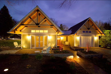 Mid-sized trendy white one-story wood exterior home photo in Other