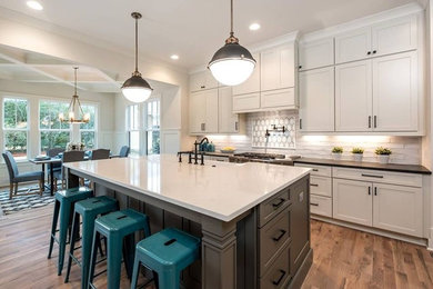 Inspiration for an eclectic kitchen remodel in Charlotte with a farmhouse sink and solid surface countertops