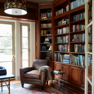 This is an example of a mediterranean home office and library in Los Angeles with a reading nook, brown walls, medium hardwood flooring, a freestanding desk and brown floors.