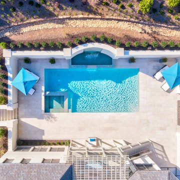 Birds' Eye View of Back Yard Oasis. Note river rock drainage swell at the base o