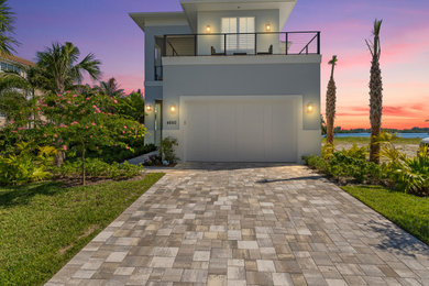 Example of a beach style home design design in Miami