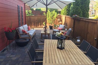 Patio - traditional backyard brick patio idea in Portland