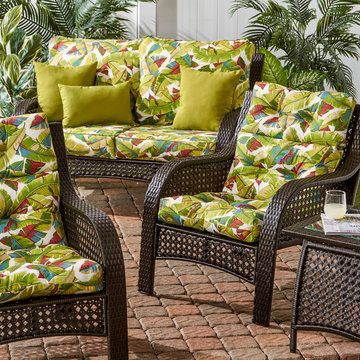 Wicker Woven Lounge Set with Palm Leaf Pattern Cushions and Bright Green Accent