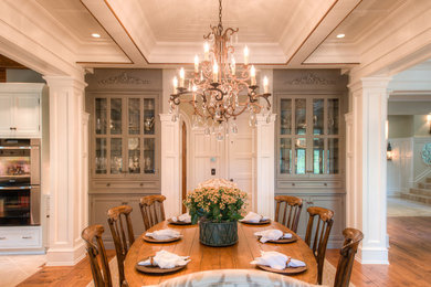This is an example of a traditional kitchen/dining combo in Charleston with medium hardwood floors.