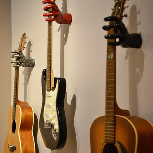 Design ideas for a small contemporary fully buried basement in Raleigh with purple walls, carpet and beige floors.