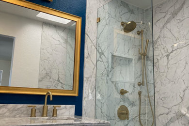 Mid-sized trendy 3/4 marble tile single-sink and vaulted ceiling bathroom photo in San Francisco with shaker cabinets, gray cabinets, blue walls, marble countertops, a built-in vanity, a drop-in sink and gray countertops