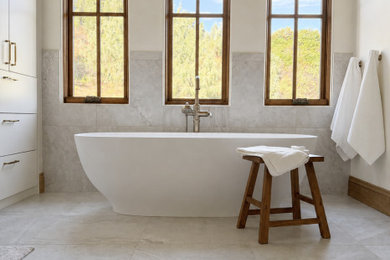 Large tuscan bathroom photo in Denver