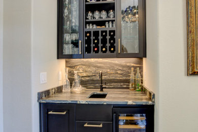 Home bar - mediterranean home bar idea in Austin