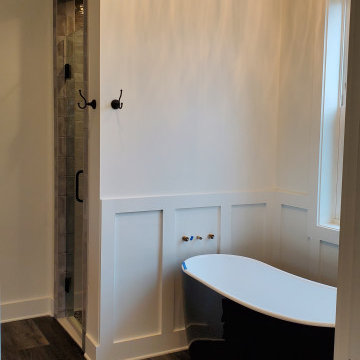 Shower design done with penny rounds on the accent wall and shower floor