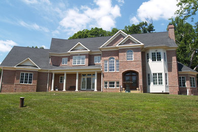 Example of a huge classic brick exterior home design in DC Metro