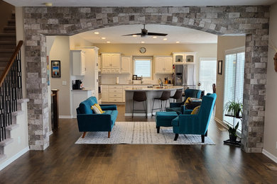 Mid-sized transitional open concept laminate floor and brown floor living room photo in Omaha